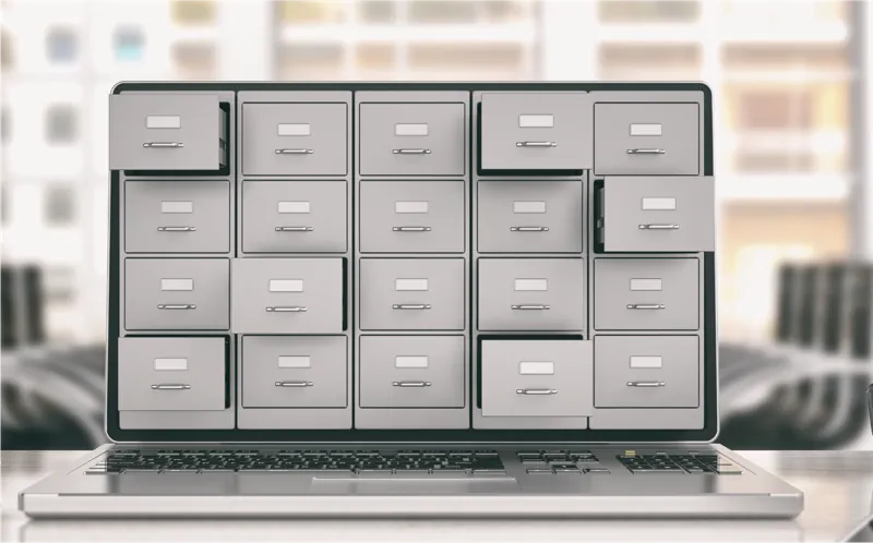 Architect laptop on a desk, with a row file cabinets in place of the screen.